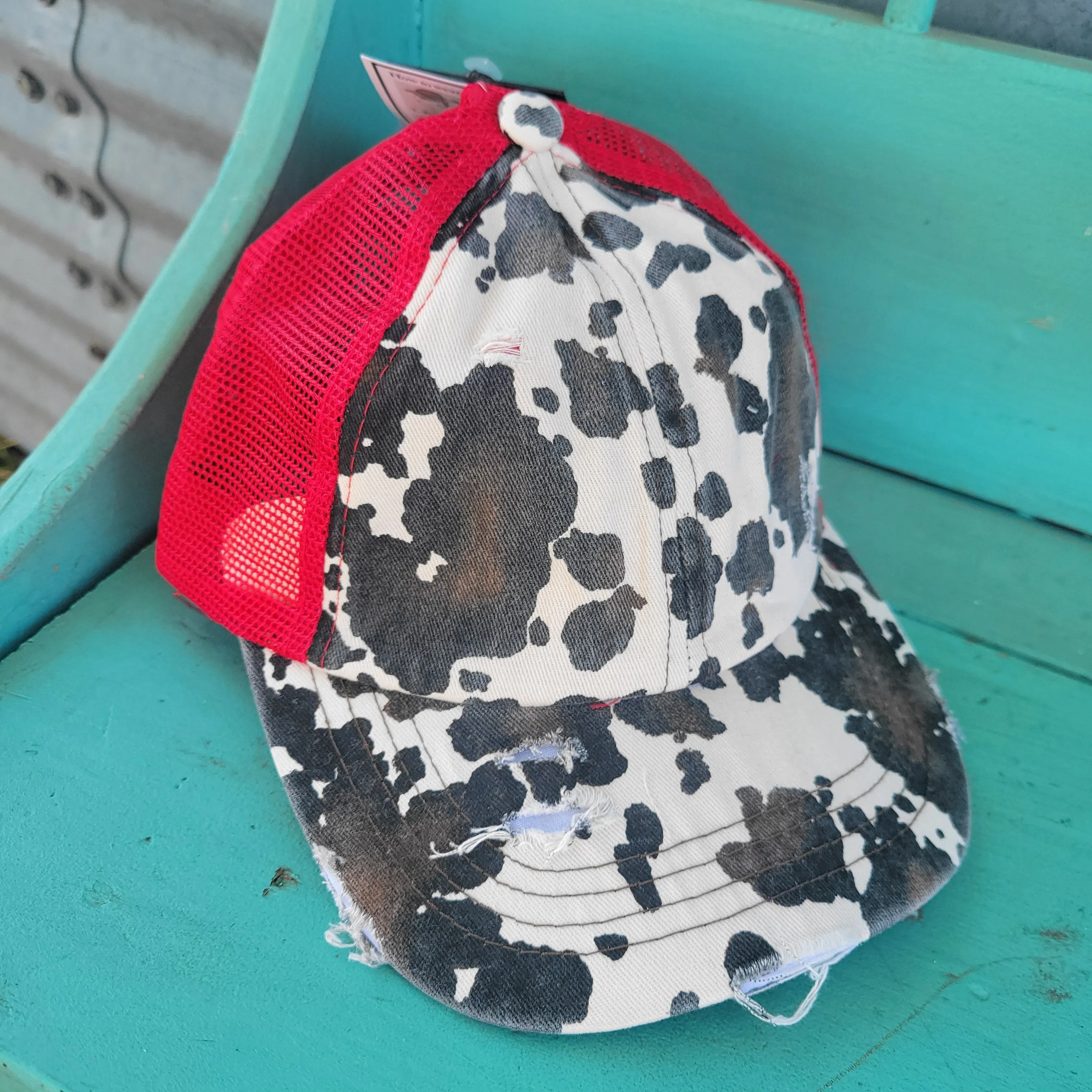 C.C. Cow Print Criss Cross Ponytail Hat - Red